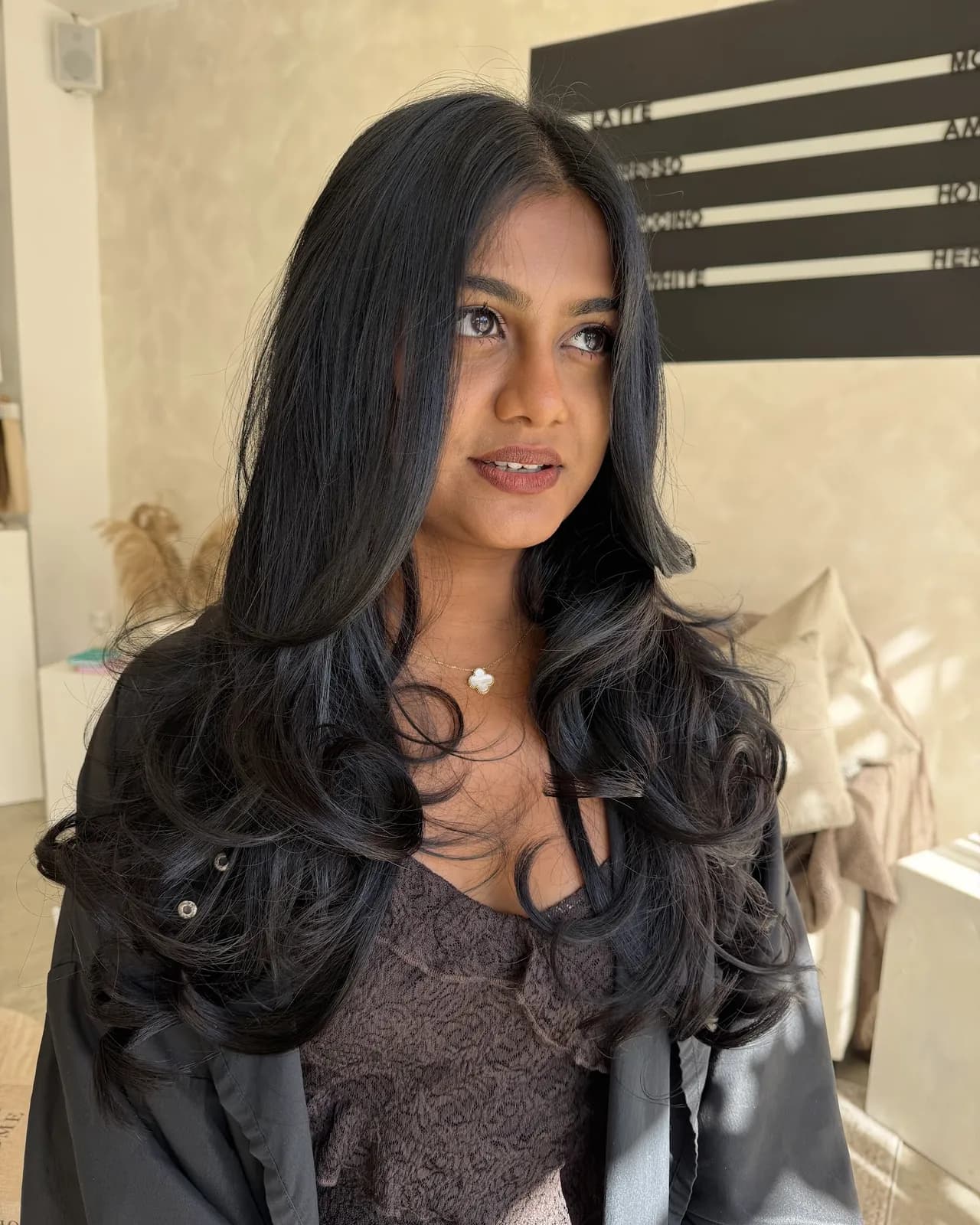Long, glossy jet-black waves after a gloss and two packs of hair extensions, Crown Perfect, Surrey